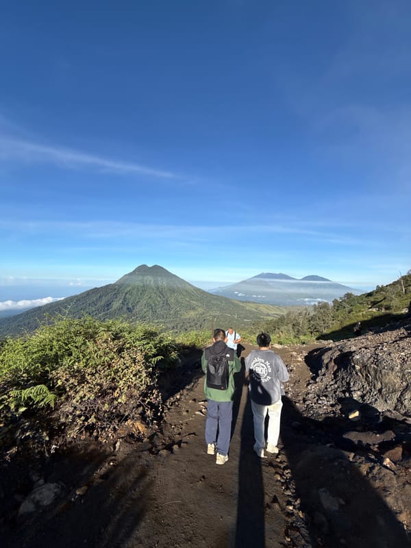 Two hikers spotted on narrow mountain path in Indonesia