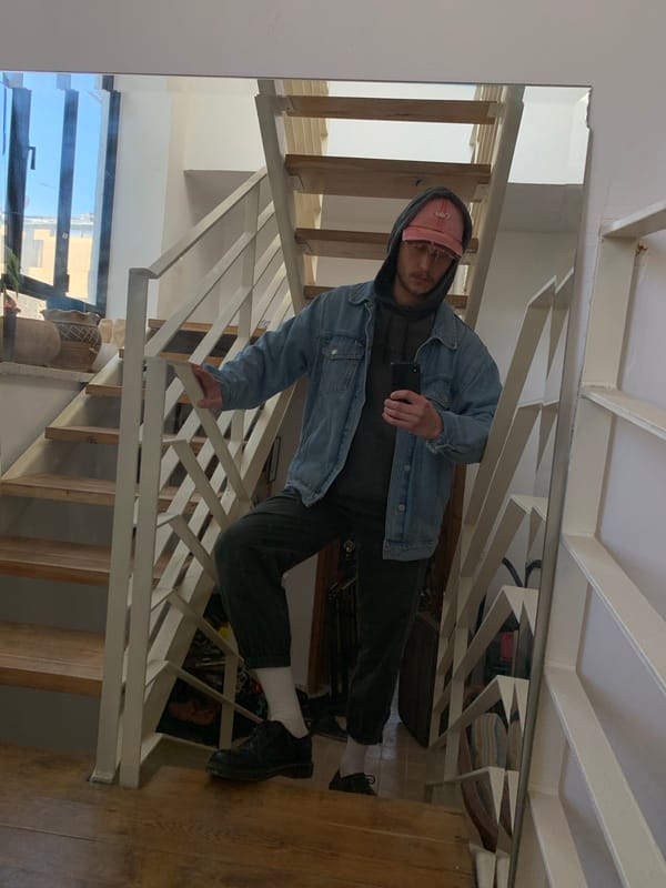 Man takes mirror selfies on staircase in Tel-Aviv residence
