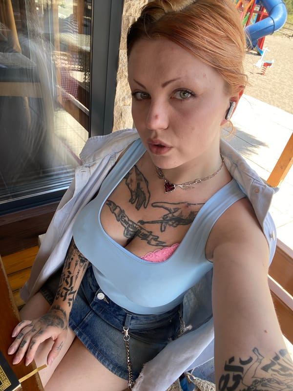 Woman dining at coastal cafe in Ulcinj, Montenegro