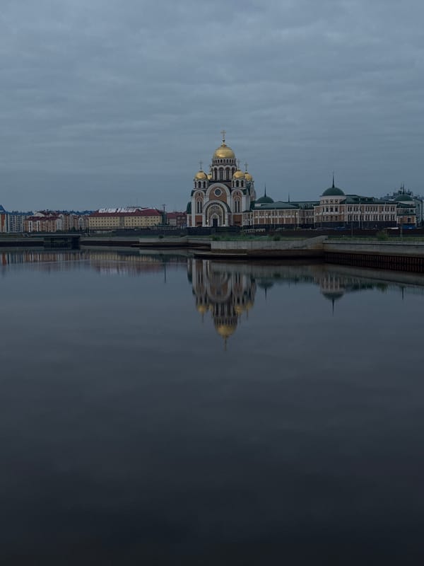 Salekhard's riverfront: golden domes and the Chum Bridge