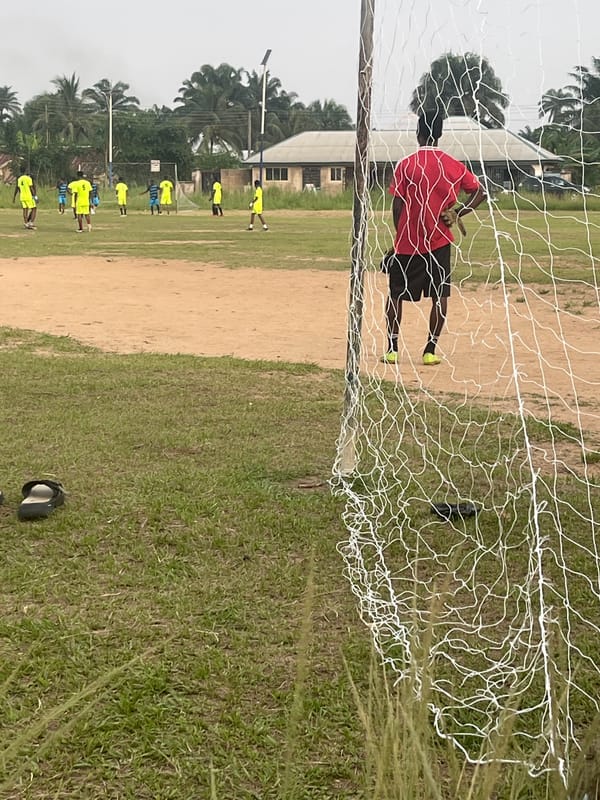 Soccer match played between yellow and blue teams