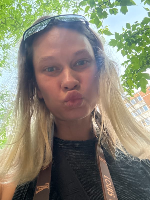 Woman takes selfie with designer bag in Perm