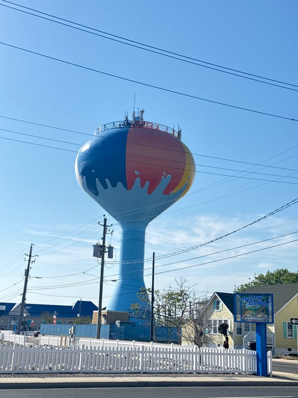 Tourist documents Ocean City landmarks during evening walkabout
