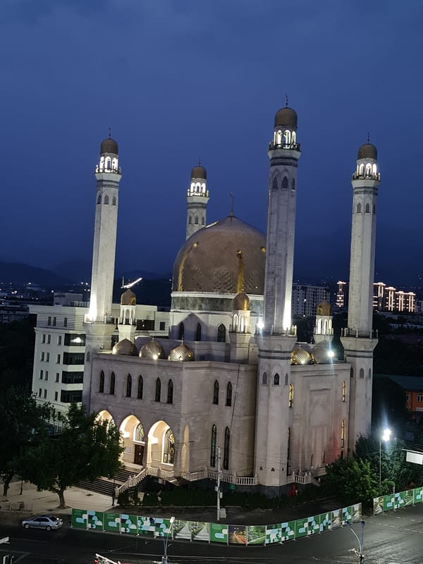 Almaty's Central Mosque glows at dusk from multiple angles