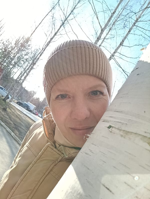 Woman takes selfies in Russian forest near Chaikovsky