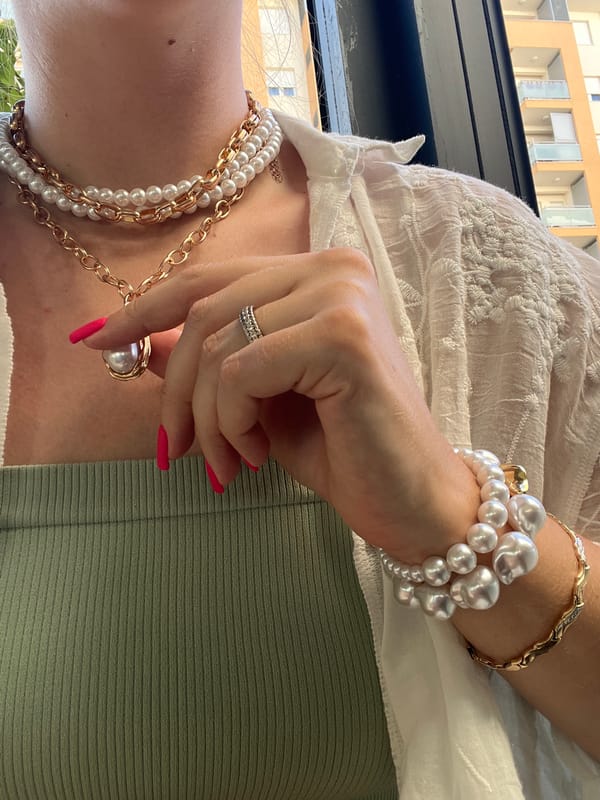 Layered jewelry and textured fabrics in Podgorica