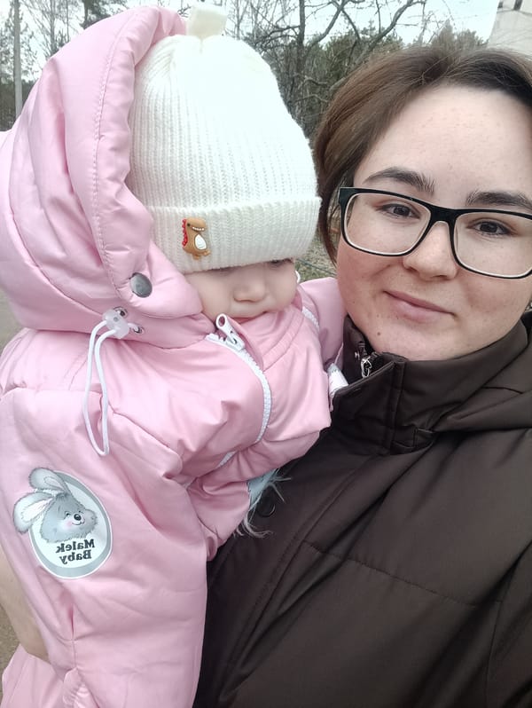 Two cats transported in pet stroller in Noviy, Russia