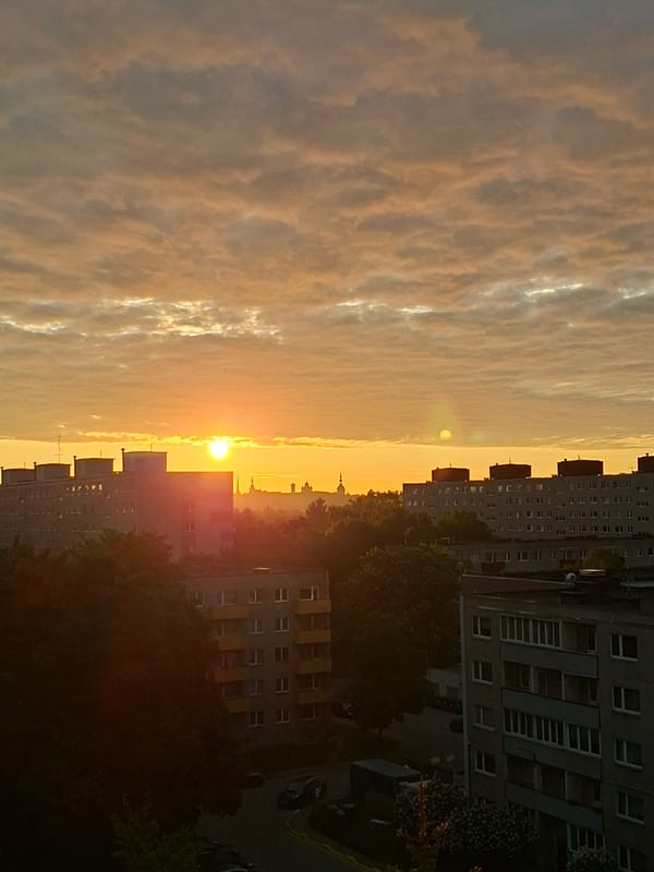 Urban sunrise captured from high-rise vantage point