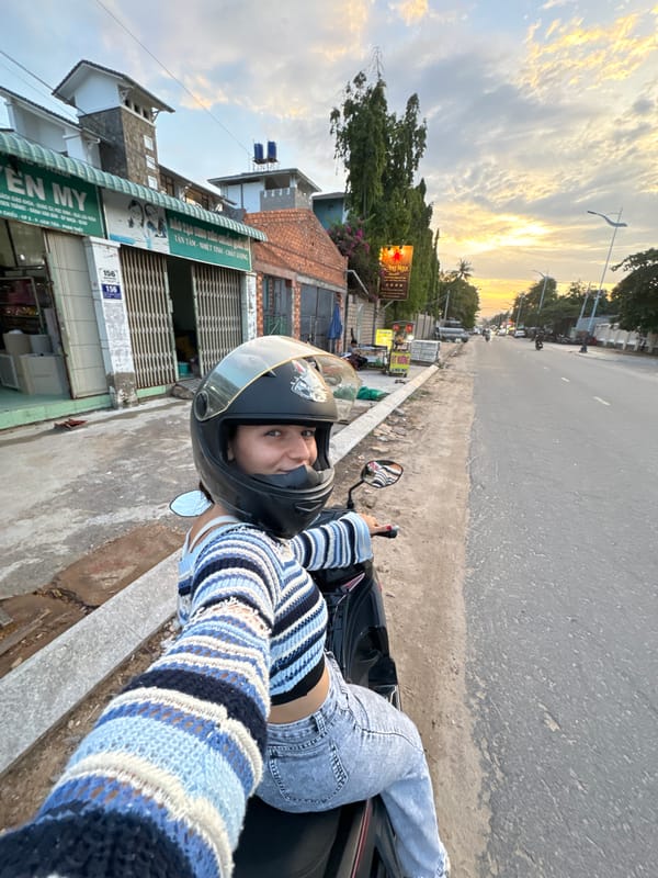 Motorcycle selfies on a Mũi Né street at dusk