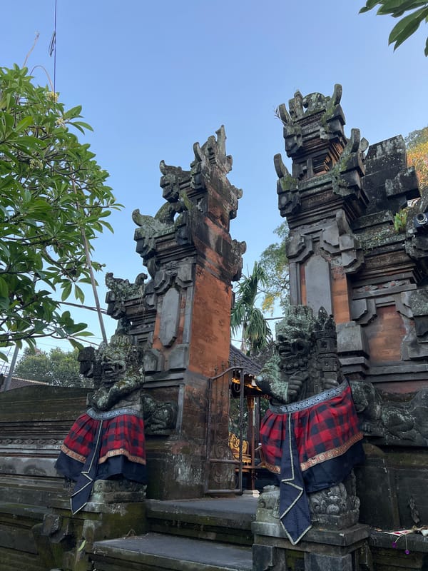 Ornate stone guardian gateway at a Balinese temple, Ubud