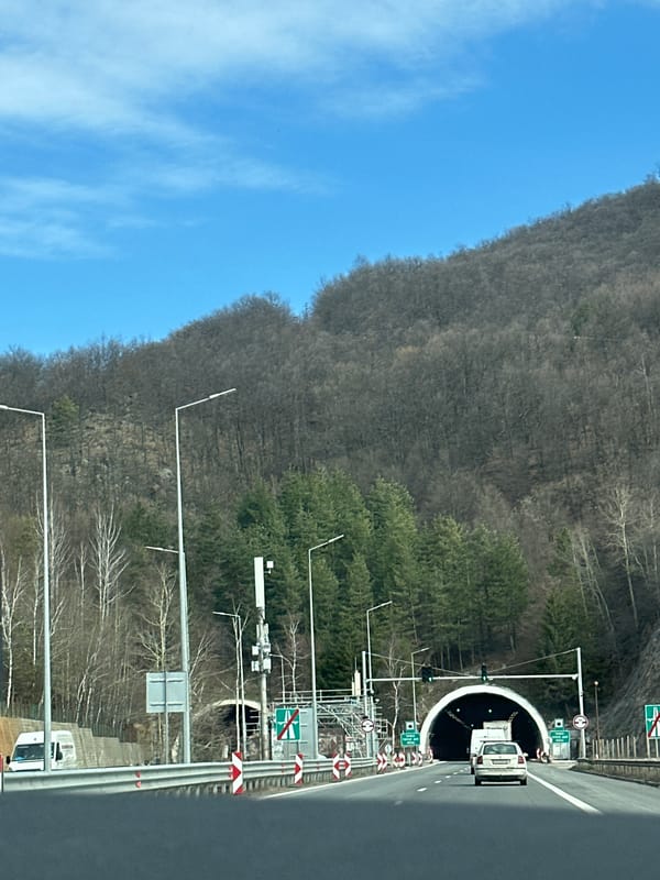 Car exits illuminated tunnel in Vrachesh, Bulgaria