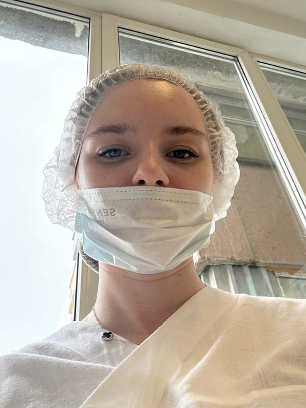 Woman documented in medical, indoor settings across Saint Petersburg