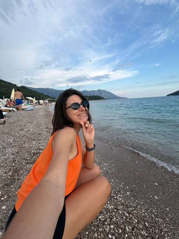 Woman documents leisurely beach afternoon in Budva, Montenegro