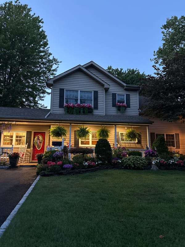 Tesla Cybertruck parked outside a Wantagh home at dusk