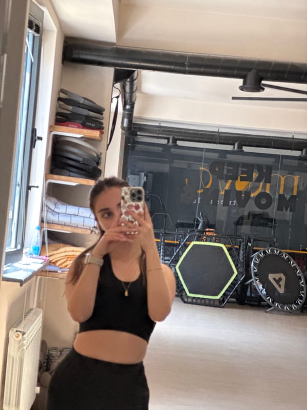 Woman takes selfie in mirrored fitness studio in Yerevan