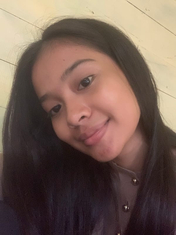 Woman takes multiple selfies in Sungai Meriam, Indonesia