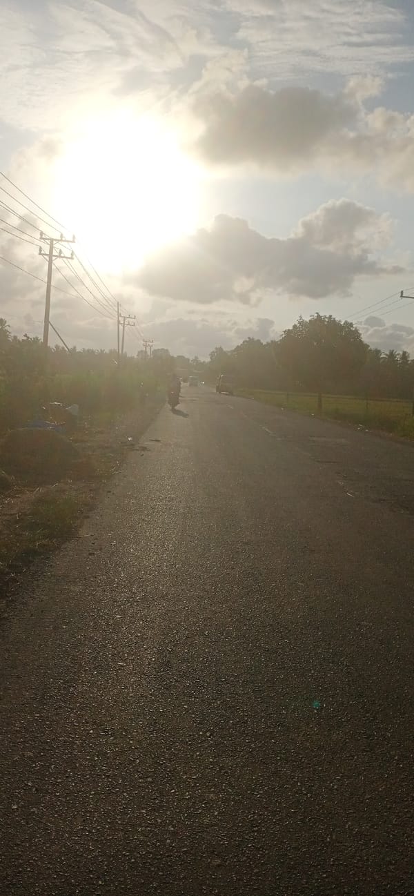 Road scene with power lines documented in Lhokseumawe, Indonesia