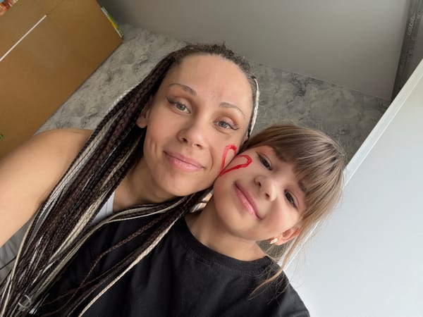 Woman and child share selfie moments in Rusanovo