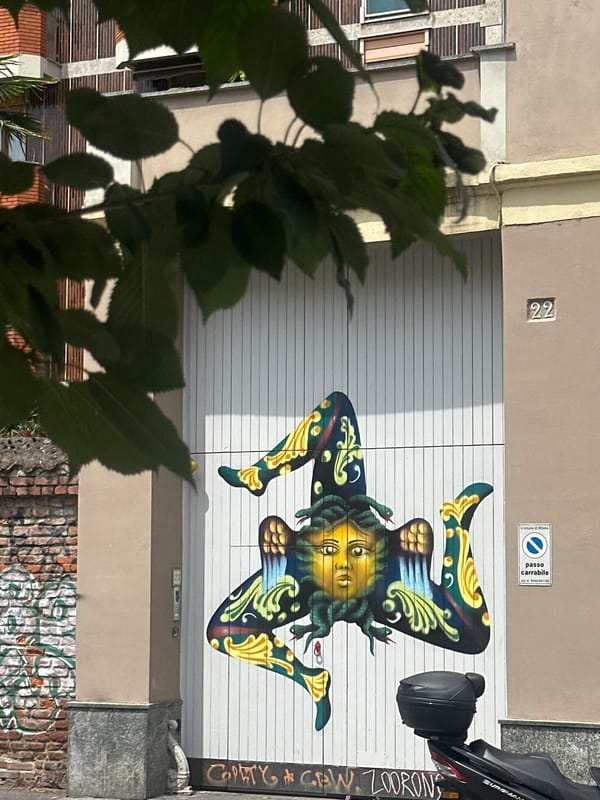 Milan morning walkabout captures street art, architecture, historical coins