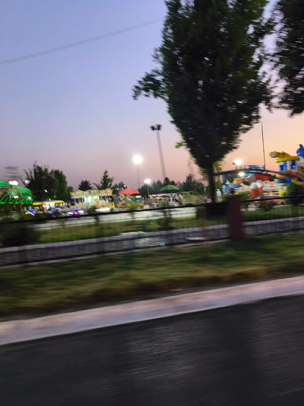 Dusk settles over a Fergana City amusement park