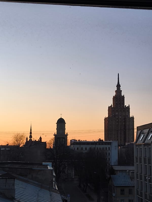 Riga resident documents sunset cityscape and evening dining scene
