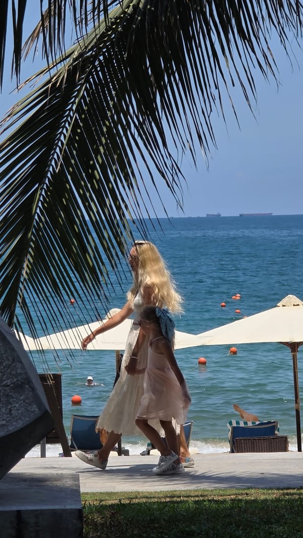 Woman stands at beachside location in Nha Trang, Vietnam