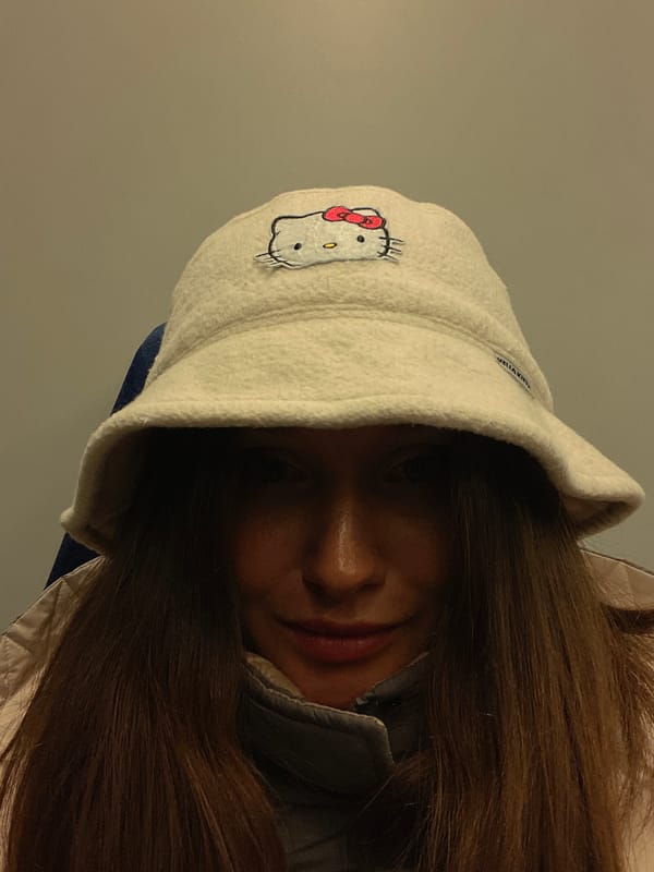Person poses in Hello Kitty hat in Sochi