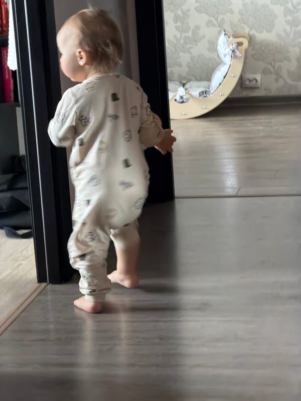 Toddler spotted standing barefoot near furniture in Chaikovsky home