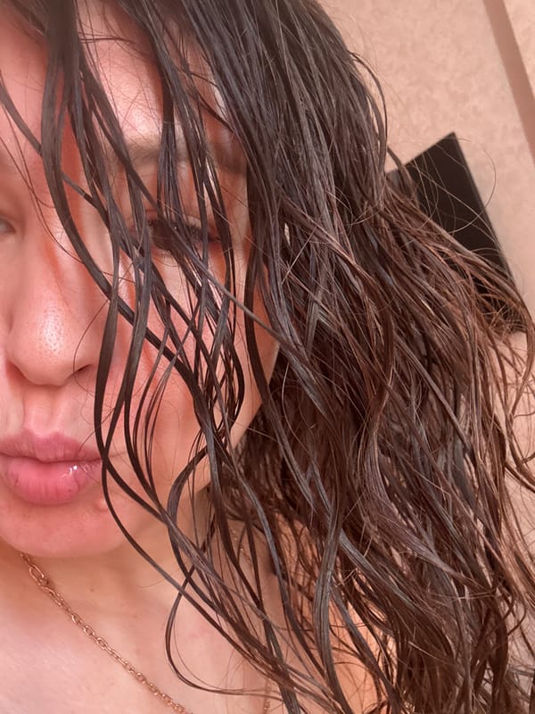 Person photographed with wet disheveled hair in Oktyabrskiy