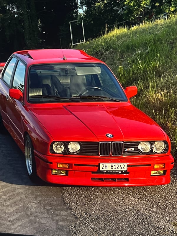 Vintage red BMW E30 M3 on rural roads near Vanadzor