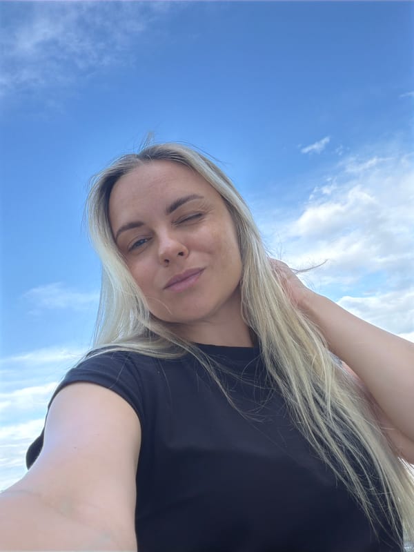 Woman takes selfies by Votkinsk Reservoir with city views