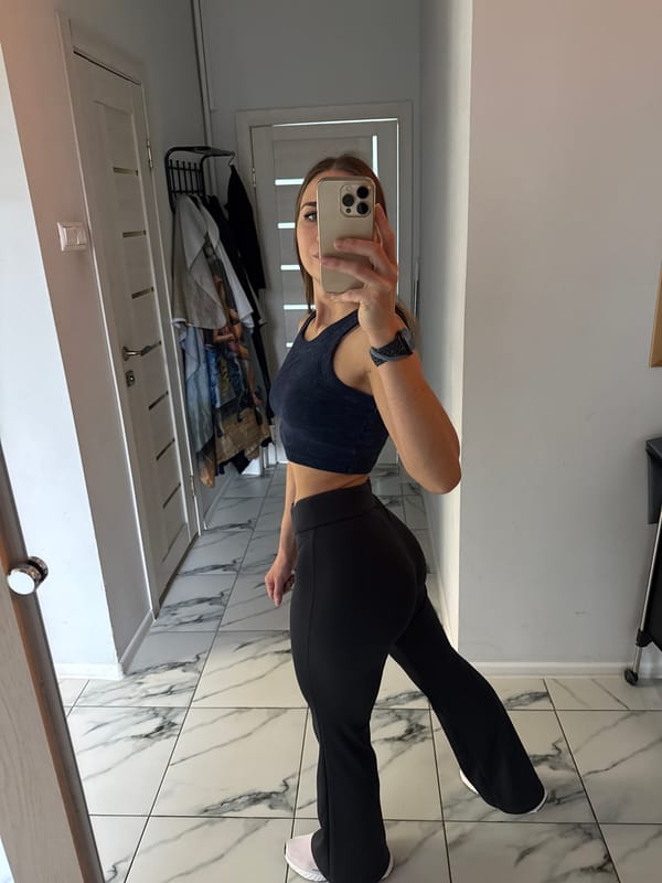 Woman Takes Mirror Selfies in Vyborg Bathroom