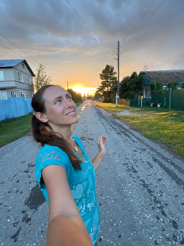 Dusk in a Russian village — wet roads and silhouetted skies