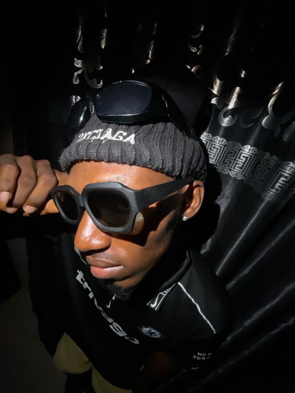 Man poses in branded clothing for photos in Lokoja