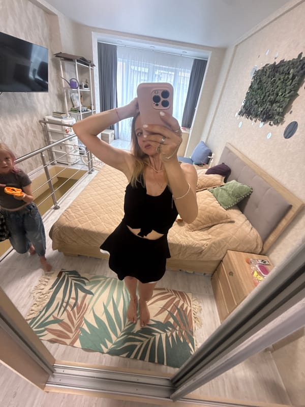 Woman Takes Extended Mirror Selfie Session in Bedroom