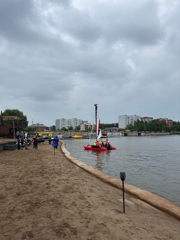 Sailing event at Votkinsk Reservoir with catamarans and shore ceremony