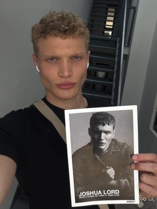Printed photograph held up in London