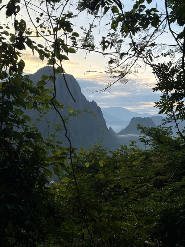 Dawn over Naka's karst valleys, seen from balloons and paraglider