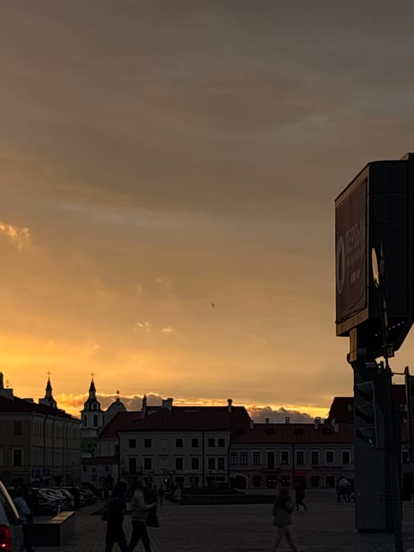 Dramatic sunset illuminates central Minsk during evening rush hour