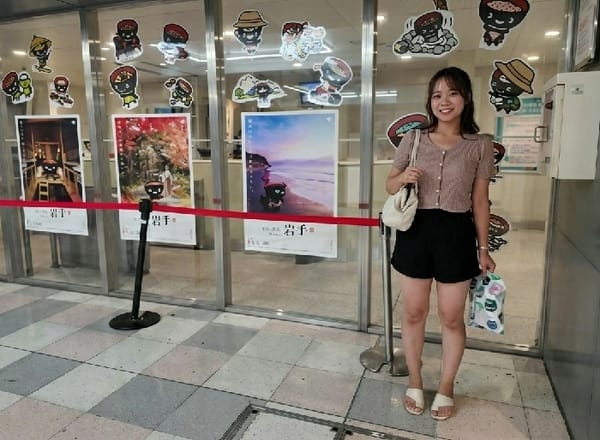 Woman photographed smiling at Shibuya transportation hub