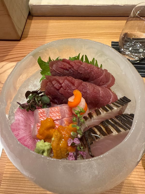 Chef prepares sashimi and matcha service in Minato restaurant