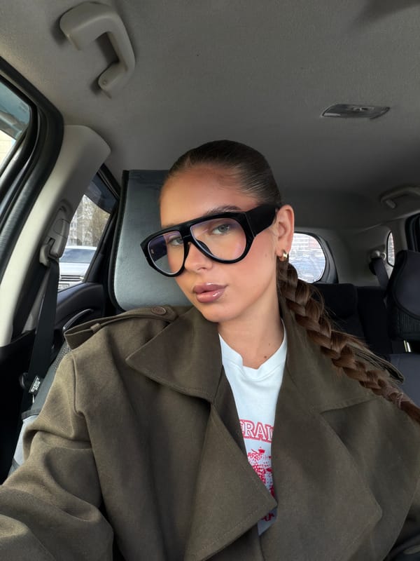 Woman in braids observed in car passenger seat, Krasnoyarsk