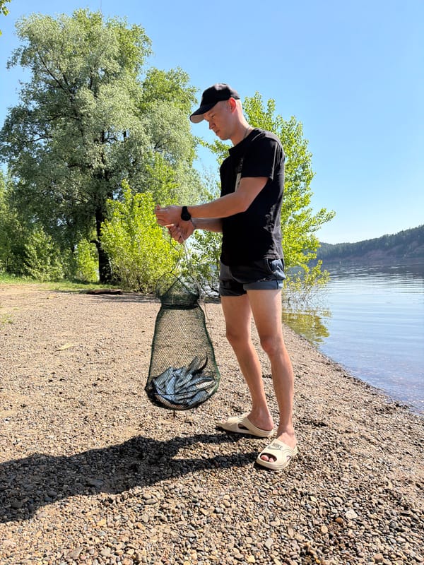 Dog walk documented along Russian lake with fishing, selfies