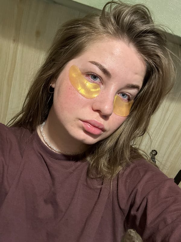 Woman documents skincare routine with golden eye patches in Russia