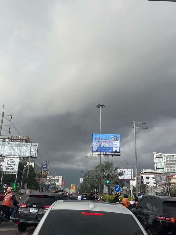 Morning traffic flows through Pattaya under cloudy skies