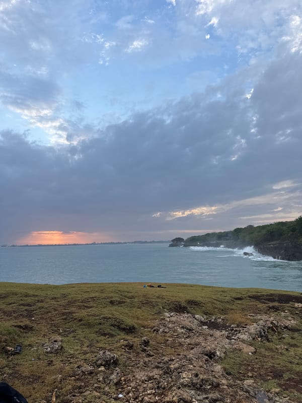 Cloudy sunset captured along Kuta Selatan coastline