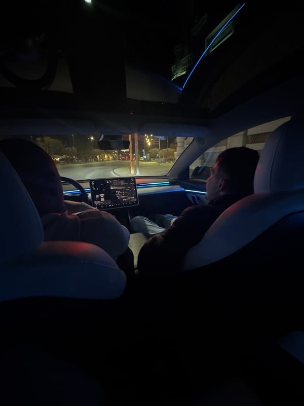 Driver views illuminated church from Tesla in Varna