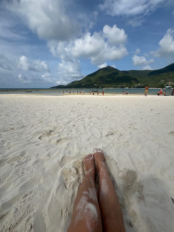 Woman enjoys morning beach time in Baan Chaloklum, Thailand