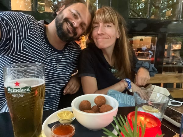 Snacks and smiles at an outdoor table in Delft