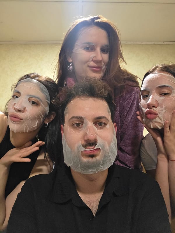 Four people pose for selfie in white attire, Bulgaria
